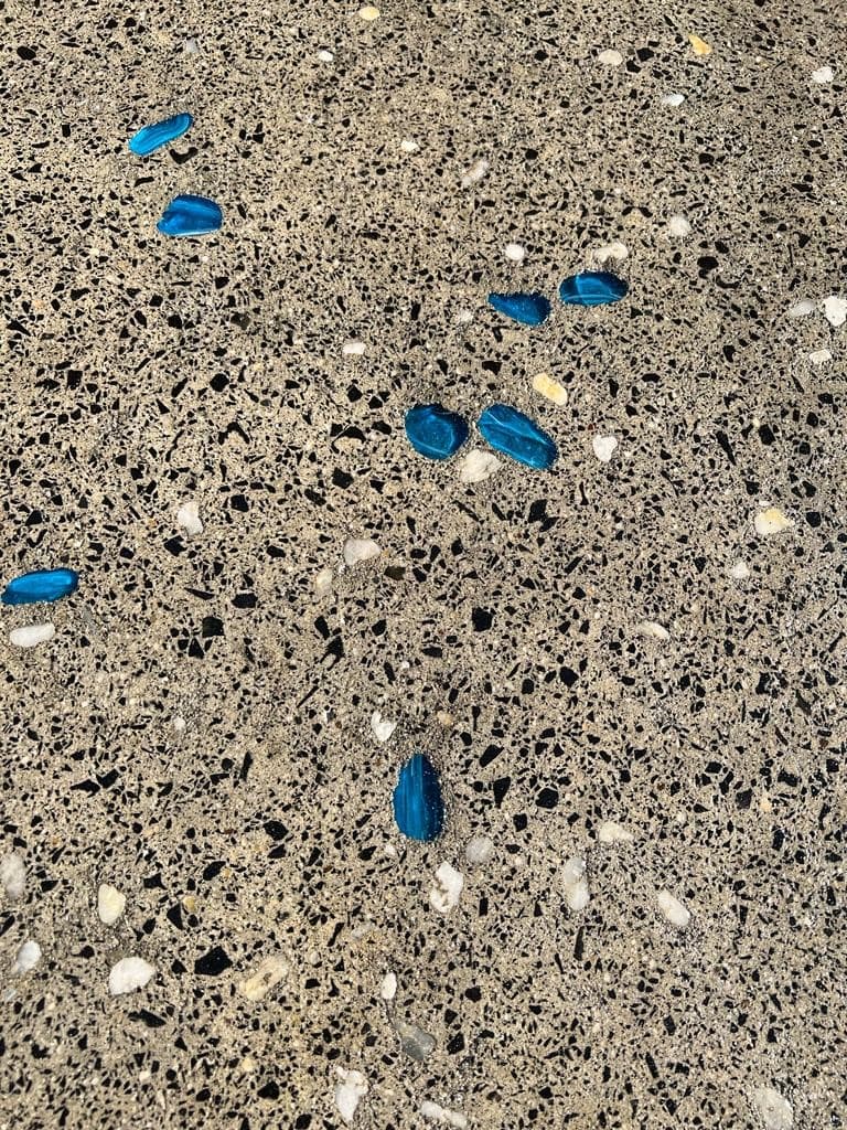 Full aggregate exposure with glass through the slab, ground back and polished