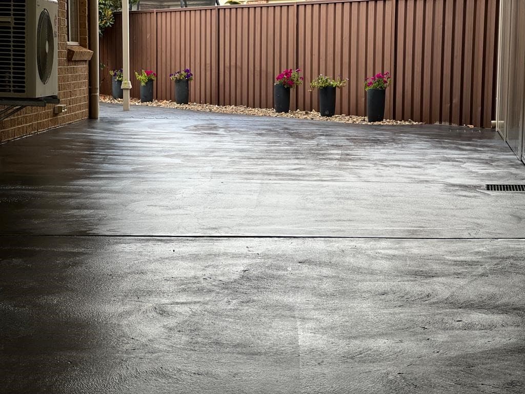 Charcoal resurfaced driveway at a home in Glenmore Park